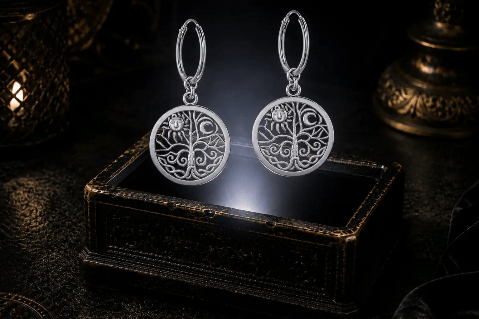 Sterling silver Celtic Tree of Life sun and moon hoop earrings floating above a glowing ornate jewelry box in a dark luxurious mystical setting with cinematic lighting