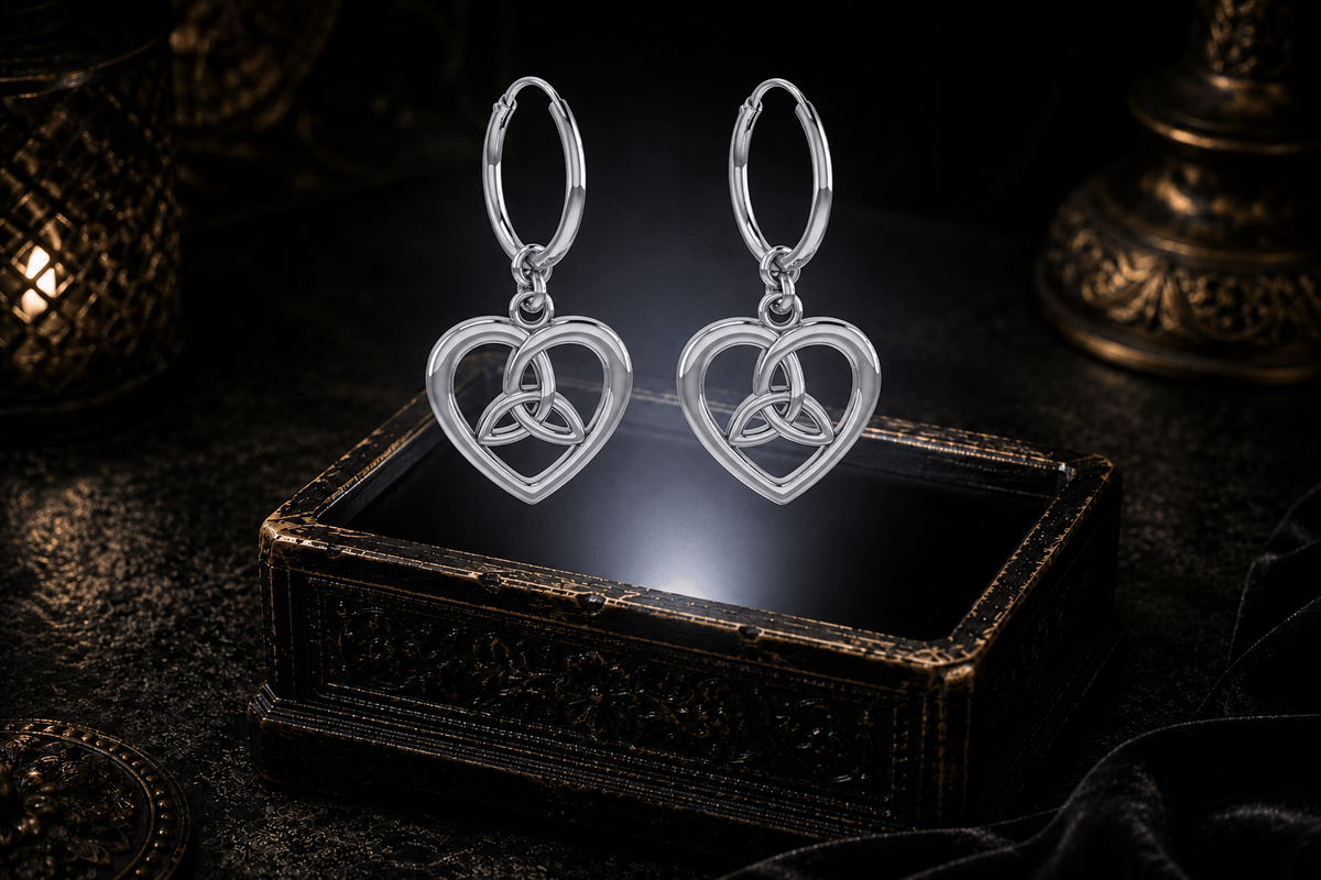 Sterling silver Trinity knot hoop earrings with polished openwork heart drops