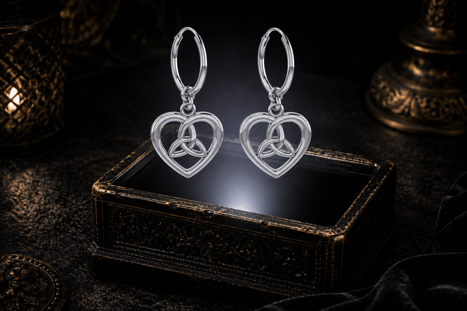 Sterling silver Trinity knot hoop earrings with polished openwork heart drops