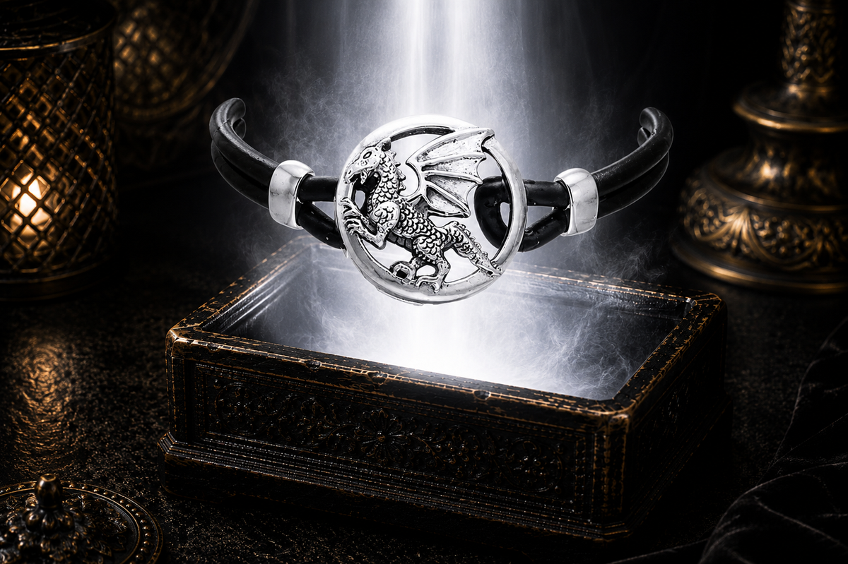 Sterling silver winged dragon leather cord necklace floating above an ornate jewelry box surrounded by glowing mist in a dark cinematic luxury setting